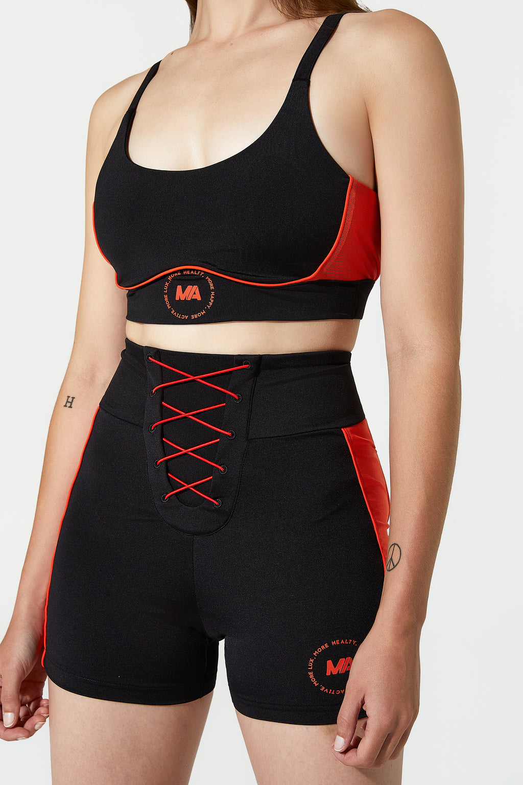 Black and red athletic outfit with a sports bra and compression shorts
