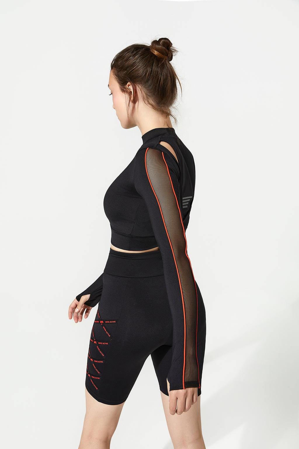 Womens black gym gear athletic outfit with mesh panels on gymnasium t shirt and running cycling shorts


