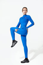 Person wearing a blue athletic outfit on a white background