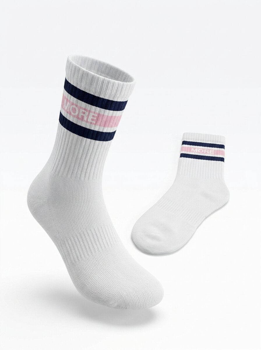 Pair of white half-crew throwback socks with a maritime blue and ballerina pink double stripe and MORE wordmark